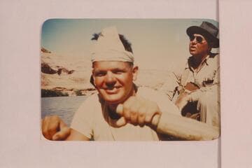 Boatman George Wing at the oars.  Max Krueger in background.  Max was regional geologist for Union Oil