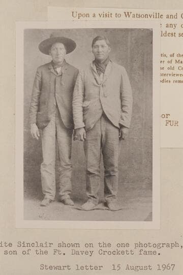 White Sinclair at right; other man unidentified