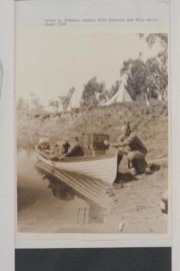 Lewis R. Freeman posing with Radiola and Elto motor