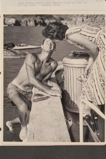 Norm Nevills greets Doris Nevills at end of 1948 run on Lake Mead