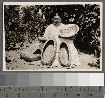 Mary Benson with some of her baskets