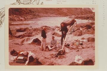 Dock Marston, Buzz and Bill Belknap. Camp at Mile 209.6 RB between Rapids #6 and #7. The head of Rapid #7 is in the background