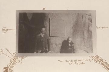 George Earley Harris, a teacher in Las Vegas Schools, and Mahlor Edwards, 10. At the second Separation Plaque before removal to the higher location. Supt. Edwards, of Boulder City Schools, was ill with a cold in a Bridge Canyon City tent